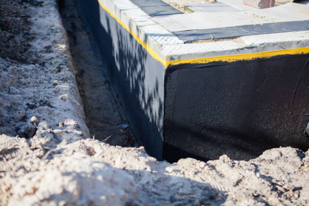 Professional Waterproofing technician working in Woodville, OH